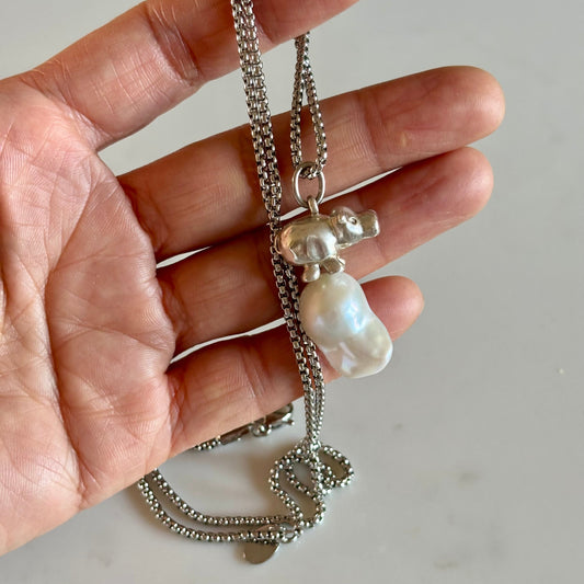 Ona Chan Jewelry Poppy Sterling silver hand carved baby hippo charm on a baroque freshwater pearl