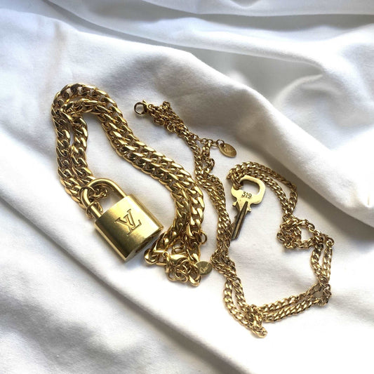 Ona Chan Jewelry LV lock and key set with Cuban Chain link on white