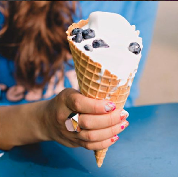 woman wearing the rose quartz Ring - Lattice Cocktail Ring holding frozen yogurt with blueberries