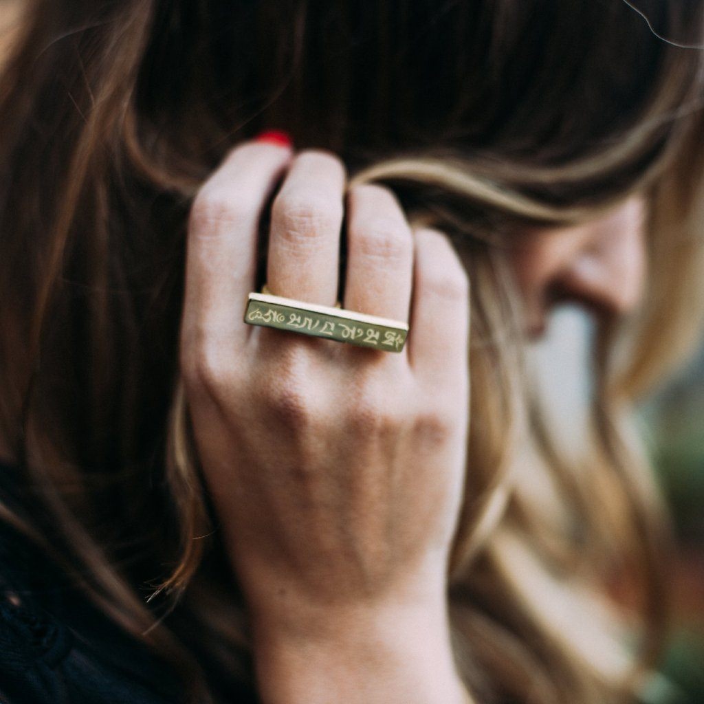 Olia of Love Olia brushing back her hair wearing Mantra Long Knuckle Ring With Edge