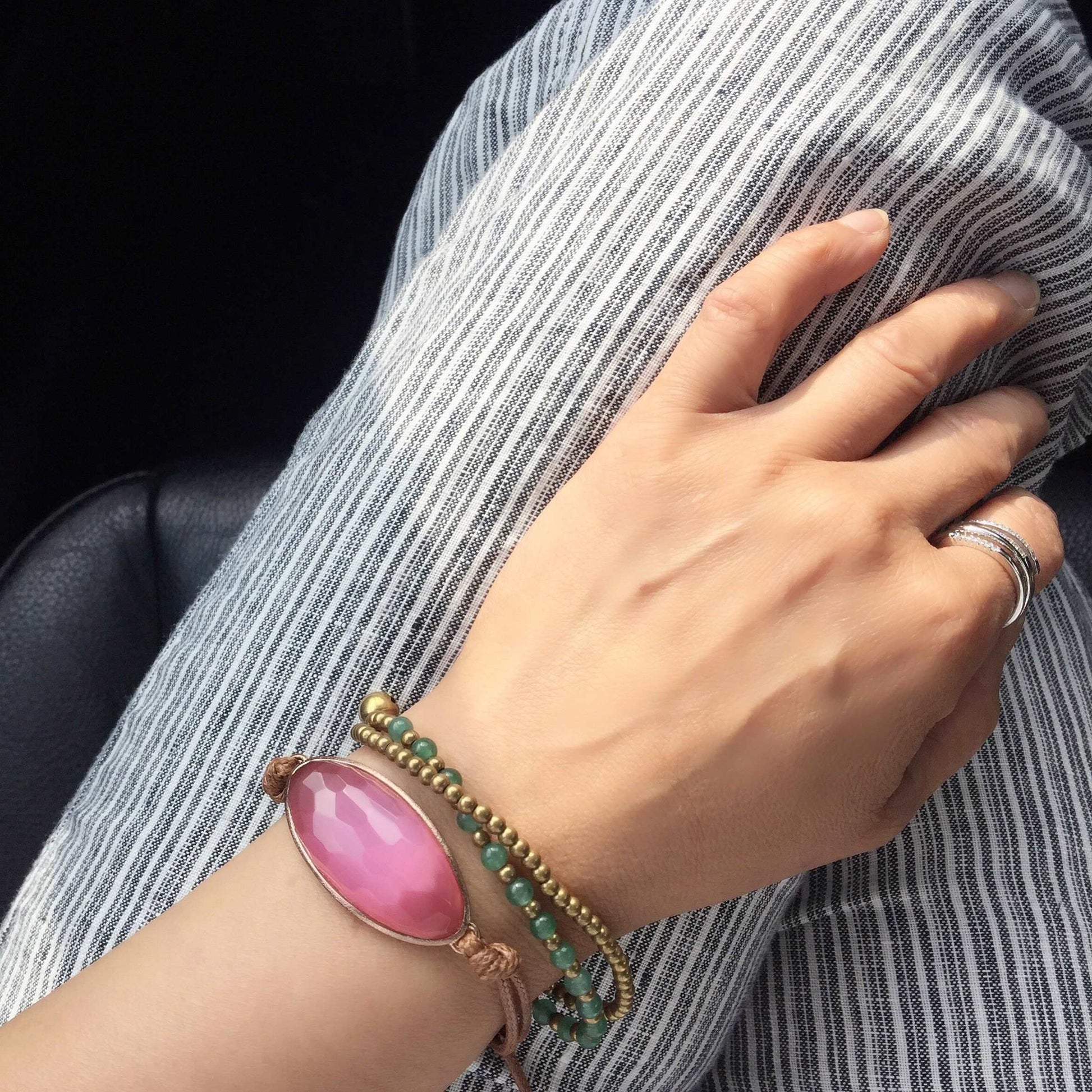 pink dignity Bracelet - Dress For Success Vancouver | Values Bracelet on striped pants