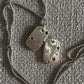 sand cast dog tags with lab sapphires 