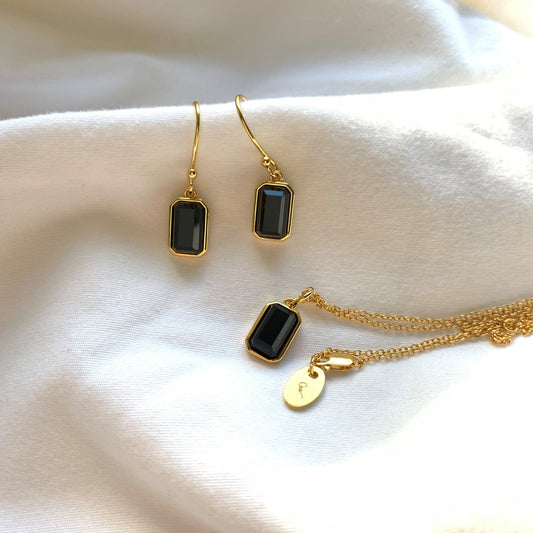Isabel drop Earrings and Isabel Necklace in Emerald Cut Black Agate in window