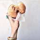 woman holding up a donut with the Dragon With Tail Cuff bracelet