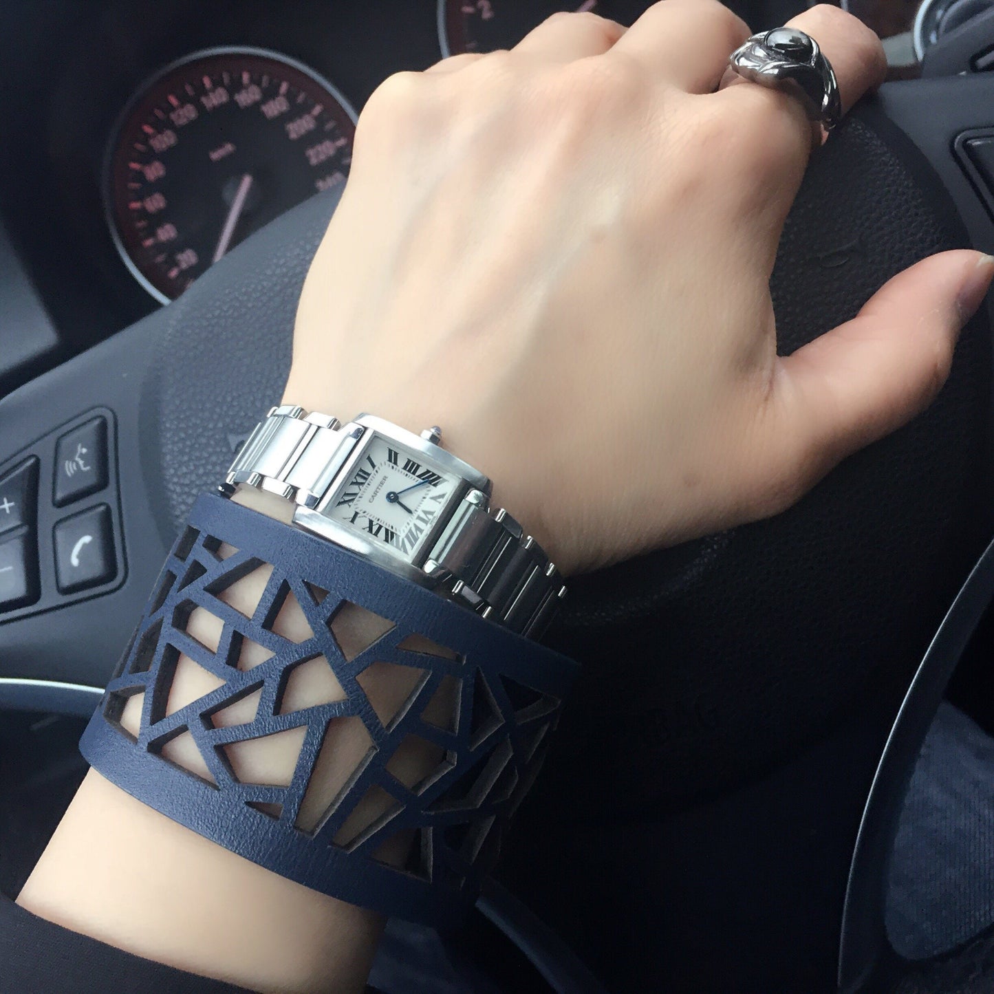 Driver wearing Margaret Laser Cut Bracelet paired with watch