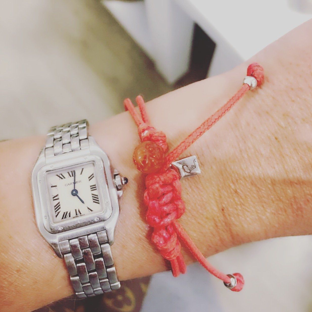 woman's wrist wearing a watch and Bracelet - String Of Destiny With Red Carnelian