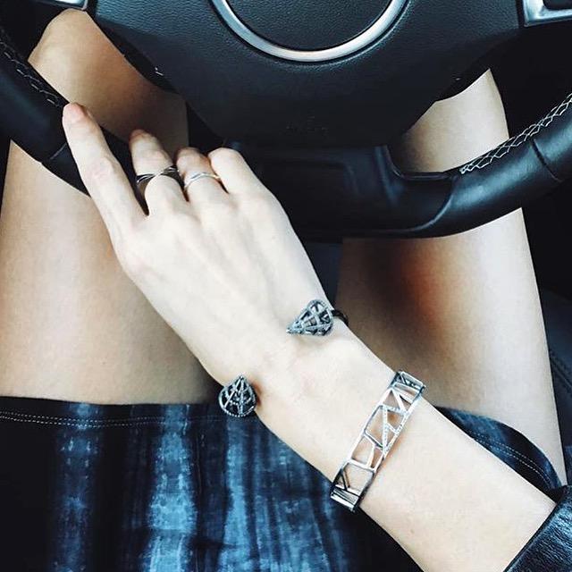 overhead view of Thoughtful Misfit Tienlyn in a car wearing Cuff - Lattice Small Cuff