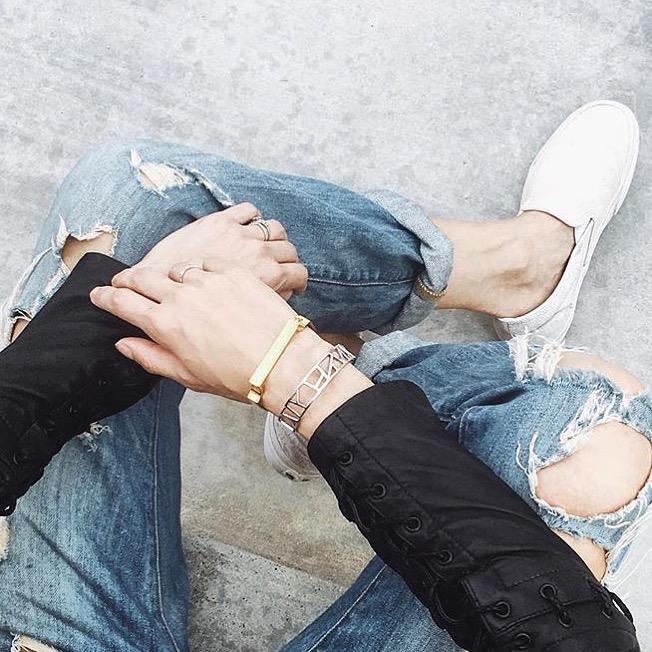 overhead view of Thoughtful Misfit Tienlyn in denim and black t-shirt wearing Lattice Small Cuff