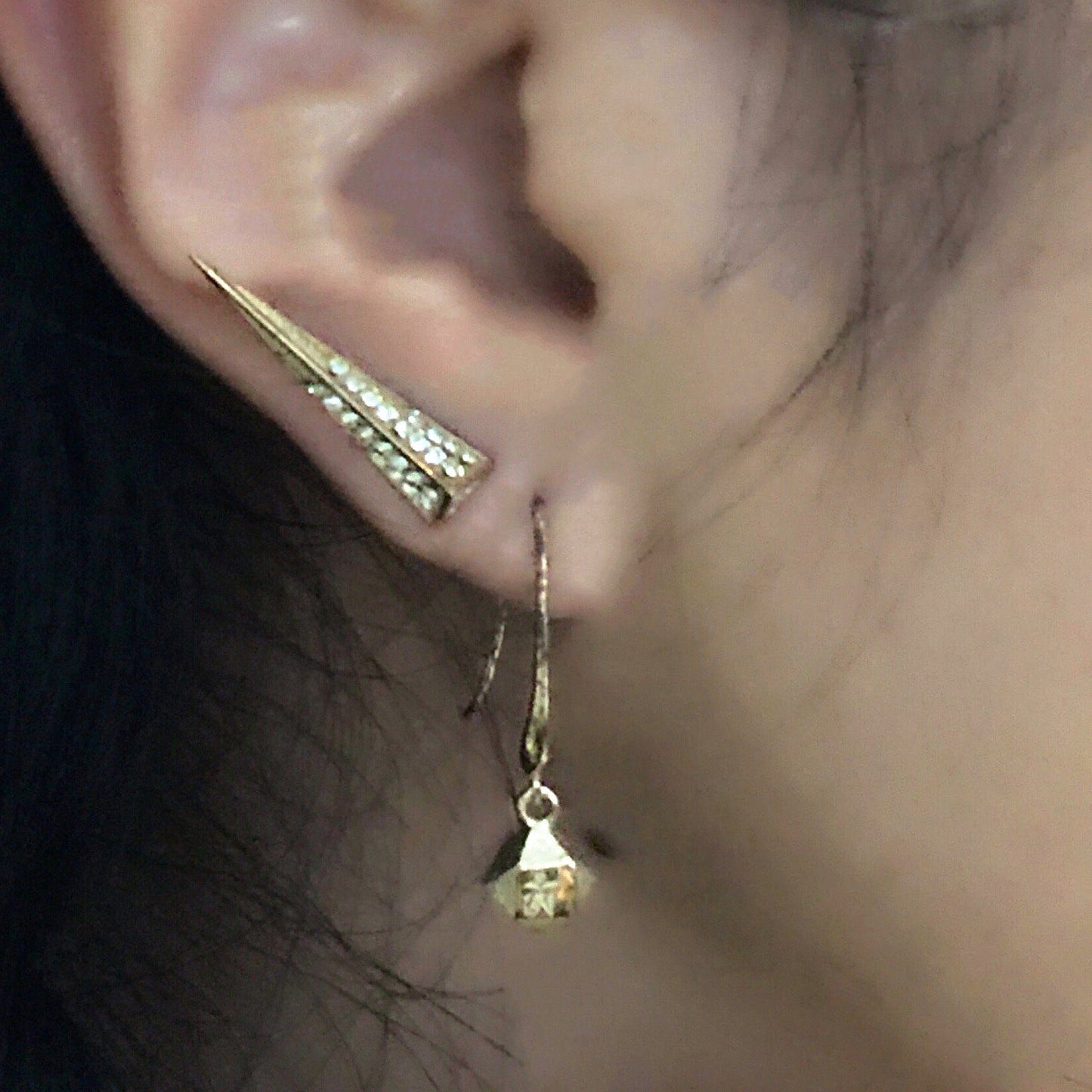 Close up of Mantra Dagger with Swarovski Crystal earrings and Mantra Cube Earrings