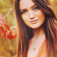brunette with light eyes wears Mantra Cube Necklace