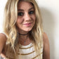 Blond boho chic girl in a striped tank wearing Mantra Dagger Pavee Pendant With Swarovski Crystals