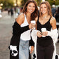 Natalia and Olga in Central Park holding coffees wearing Mantra Large Dagger Collar 