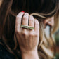 Olia of Love Olia brushing back her hair wearing Mantra Long Knuckle Ring With Edge